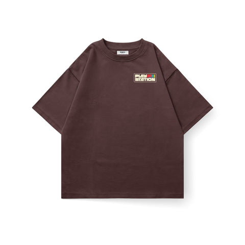 Kaihama oversized PlayStation T-shirt featuring bold branding and relaxed fit, displayed on a hanger against a plain background.