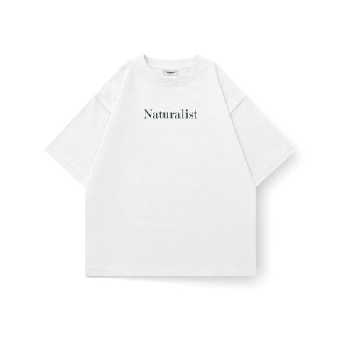 Kaihama Naturalist oversized T-shirt featuring a relaxed fit and natural fabric, displayed on a hanger against a neutral background.